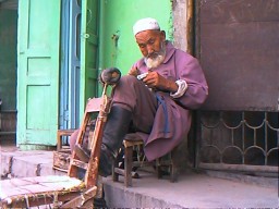 For 3 yuan (2.20TTD) this barber would shave or shape your beard. Kashgar, Xinjiang.