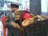 Itinerant Seller of Nan.  Kashgar, Xinjiang.