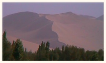 Just outside DunHuang, there is a sharp line between desert and oasis.