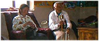 Jamyangworsals 84 year-old grandfather spent his evenings spinning his prayer wheel and reciting mantras: Om mani padme hom .  Xiewu, Qinghai.