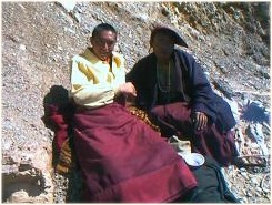 A travelling monk of the Nyingma Order, he (monk at left) generously gave me his bowl of tsampa made from roasted barley, yak butter and tea, kneaded together.  Peiyul, Sichuan.