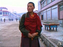 This Tibetan Buddhist nun also worked in the town digging roads, perhaps as community service or for pay.  Ganzi, Sichuan.