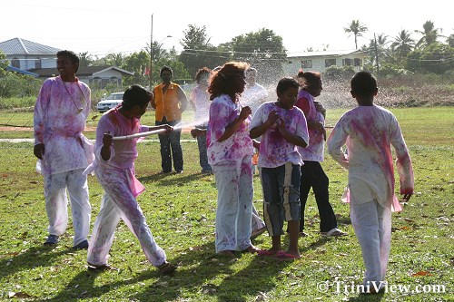People spray each other with abeer