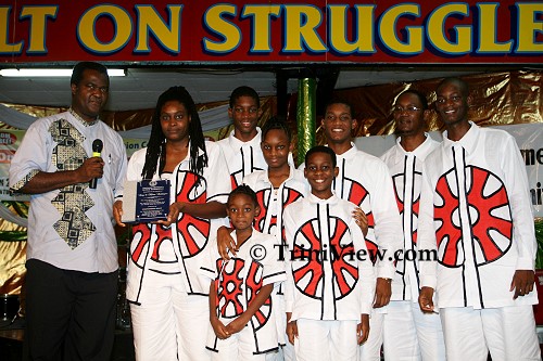 Wilfred Edwards makes a presentation to the Codrington Pan Family