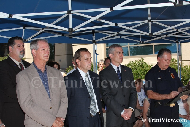 Aurora Mayor Steve Hogan, FBI Agent Jim Yacone, unknown official and Fire Chief Mike Garcia