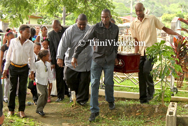 The funeral procession entering the Carenage Public Cemetery