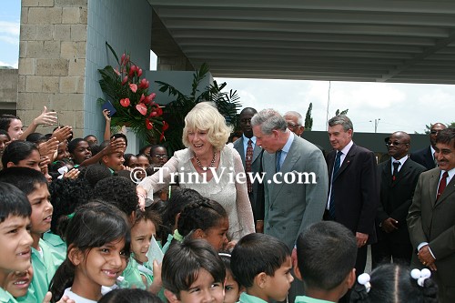 Prince Charles and Camilla The Duchess of Cornwall greet students of various schools