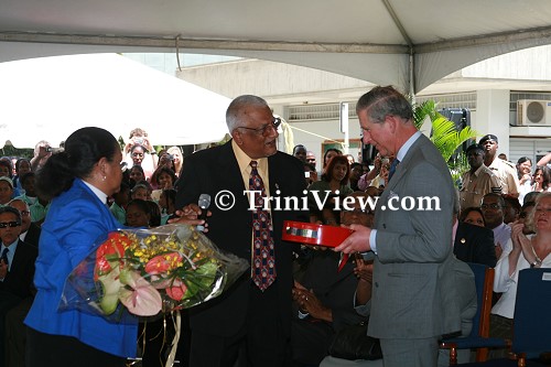 Prince Charles being presented with tokens of appreciation