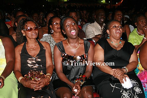 Mothers sing along at the concert