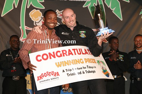 Jamie Stephenson, overall winner receives his prize from Brian Lara