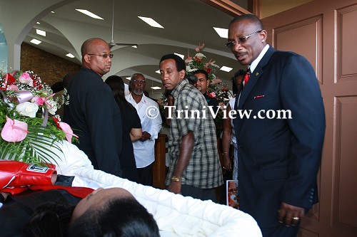 MP and Calypsonian, Winston 'Gypsy' Peters views Jizelle's body