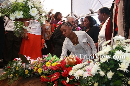 Placing wreaths on Jizelle's grave