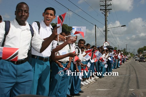 Schoolchildren lined the streets leading to the cemetery