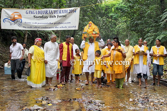 Devotees carrying the Goddess Ganga at the start of the festival