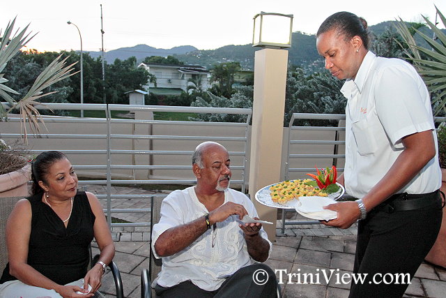 Wendy Imamashah and Paul Brathwaite being served at Party 67