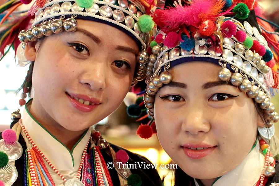 Young Chinese girls in traditional wear on the ground floor of the Lao She teahouse