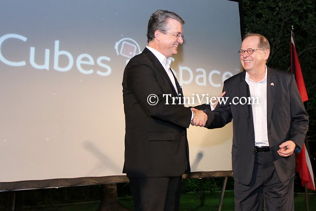 Mr. Robert Sowah, CEO of idoodlesoftware inc., presents token of appreciation to His Excellency Gérard Latulippe