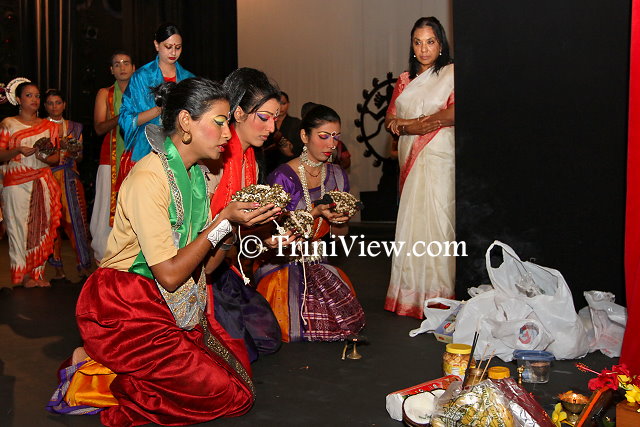 Members of the Nrityanjali Theatre participate in a puja before the show