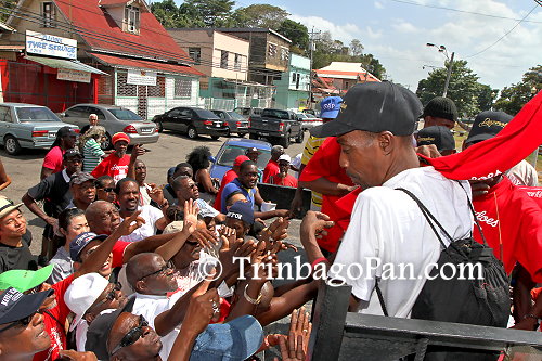 Despers T-Shirts being distributed on Picadilly Street, Port of Spain, before the motorcade