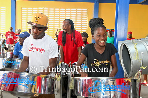 Band members perform at their home base in Laventille during their victory celebration