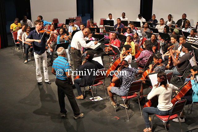 Andrew Sords, Kenneth Listhrop and Mr. Heemath Jahoor during rehearsals with the orchestra