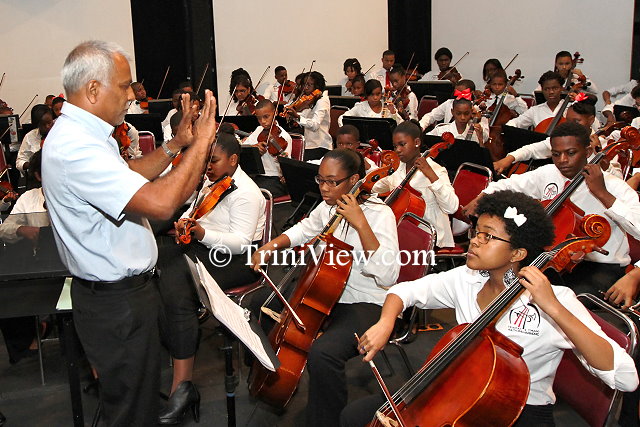 Venezuelan Head Tutor, Mr. Heemath Jahoor during rehearsals with the orchestra