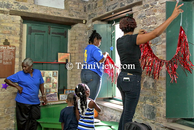 Members of Posse 67 decorating the Girl Guides Headquarters, Zoo Road, Port of Spain