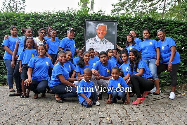 A group shot with Trinidad and Tobago Posse 67 and kids from the Trinidad and Tobago Hope Centre, San Fernando at the Girl Guides Headquarters, Zoo Road, Port of Spain