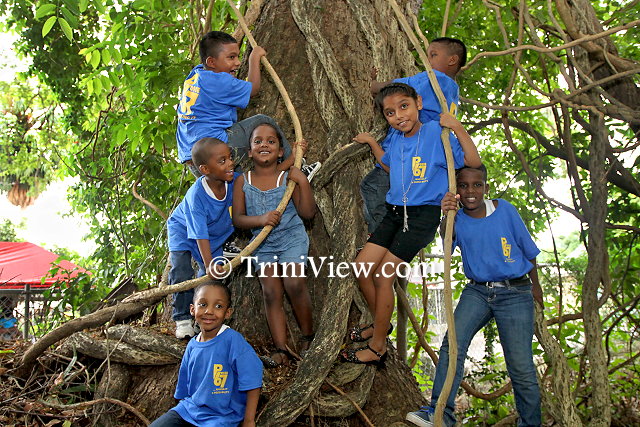 Children having fun under the tree at the Girl Guides Headquarters, Zoo Road, Port of Spain