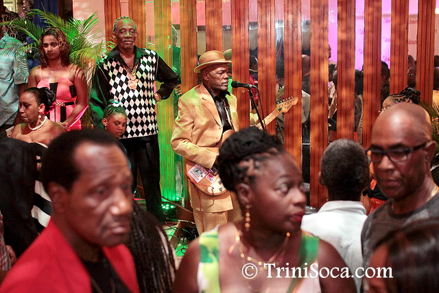 Calypsonian Neil 'Abebele' Baptiste entertains guests