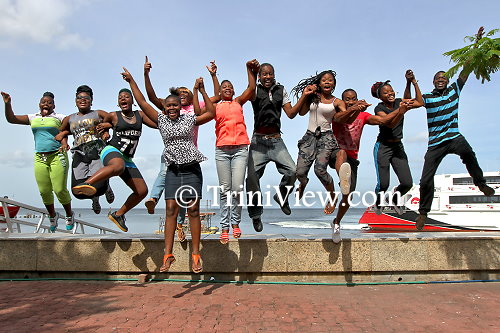 Students from the New Butler Associate College having fun at the waterfront, Port of Spain before their trip to Nelson Island