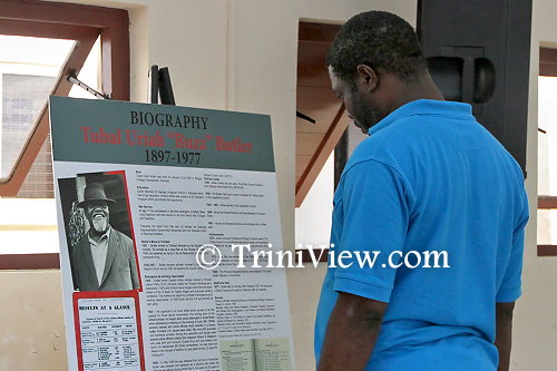 An attendee takes an interest in Butler's autobiography