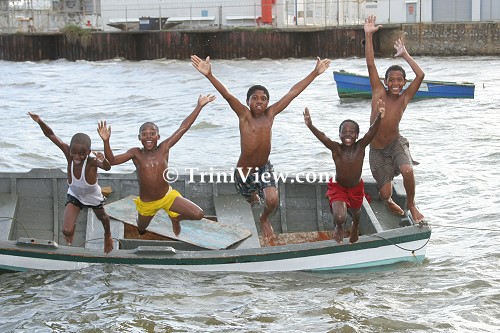 Children jumping off a boat