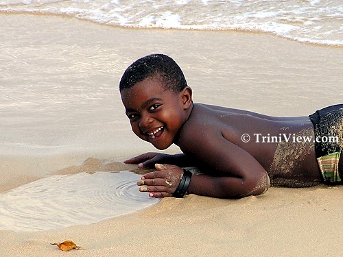 Boy on the beach at Store Bay, Tobago