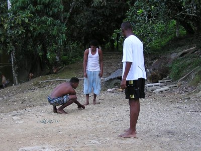 Young villagers pitching marbles in Morne La Croix Village