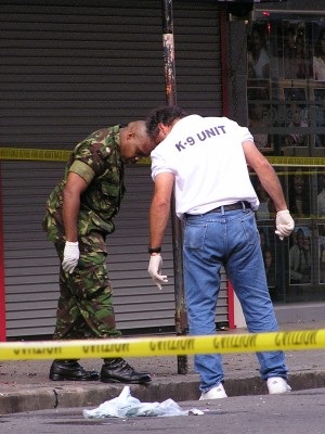 Officer from the K 9 Unit and an Army Officer at the scene of the Explosion